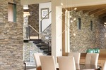 The Aurea House Plans 2453 | Contemporary House Plans with Warm & Inviting Interiors The Aurea House Plans 2453 | <a href="http://houseplans.co/house-plans/2453/" title="The Aurea House Plan 2453">The Aurea House Plan 2453</a>: This modern angled house hugs the landscape with its low-slung roofline, sprawling layout, and use of natural materials. Inside, vaulted beam ceilings, a fireplace, stone walls, and a surfeit of built-ins create a welcome feeling. For those who like lots of room, this plan is perfect—it includes a luxurious master suite, a quiet library, a gym and a sauna. | Contemporary House Plans with Warm & Inviting Interiors