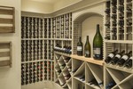 The Chatham Plan 2472 | 7 House Plans with Stunning Wine Cellars & Wet Bars The Chatham Plan 2472 | <a href="http://houseplans.co/house-plans/2472/" title="The Chatham House Plan 2472">The Chatham House Plan 2472</a>: The Chatham’s wine cellar is compartmentalized for easy organization. Its location just off the kitchen makes it easy for chefs to select excellent wine pairings. | 7 House Plans with Stunning Wine Cellars & Wet Bars